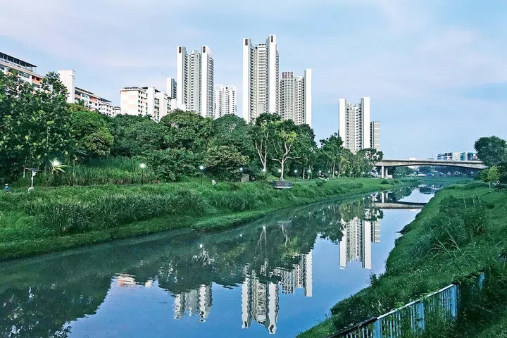 The new Clementi NorthArc HDB flats (tall buildings) are seen reflected in the Sungei Ulu Pandan canal on May 4, 2023.