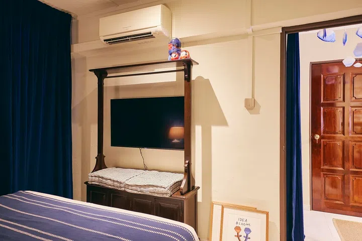 The bedroom alone has a television, keeping shared spaces focused on conversation rather than screens.
