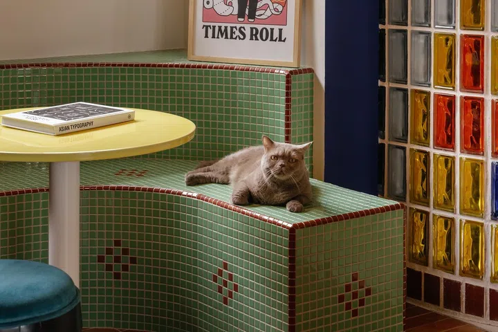 A green mosaic bench injects nostalgia.