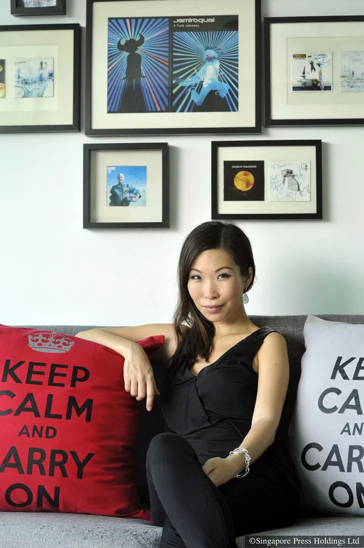 Power 98 DJ Shareen Wong posing in her shoebox studio condominium in Buona Vista in 2016.