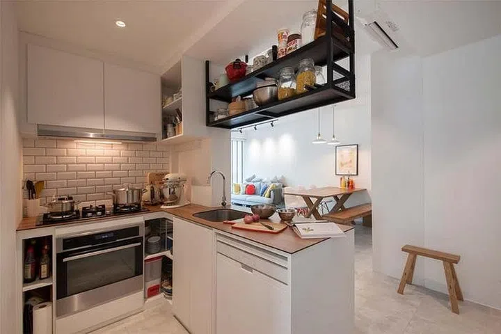 Scandinavian style small kitchen design with a small kitchen island table