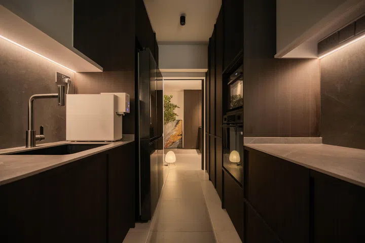  Flush cabinetry conceals the bomb shelter and generous storage, keeping the kitchen streamlined and clutter-free.
