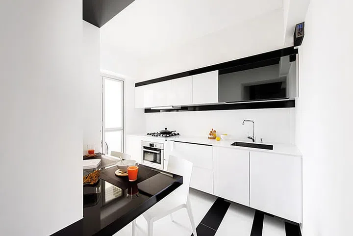 A built-in surface was sufficient as a dining table as the couple often eat in front of the television.