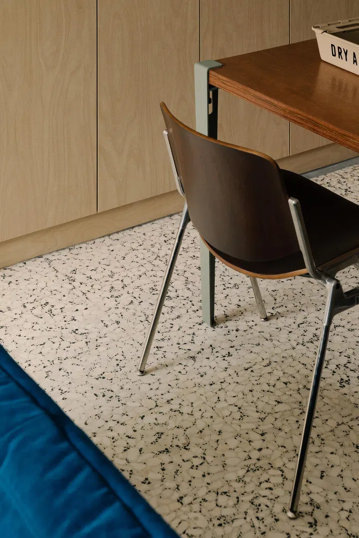 The original terrazzo lighting was preserved and carries throughout the home.