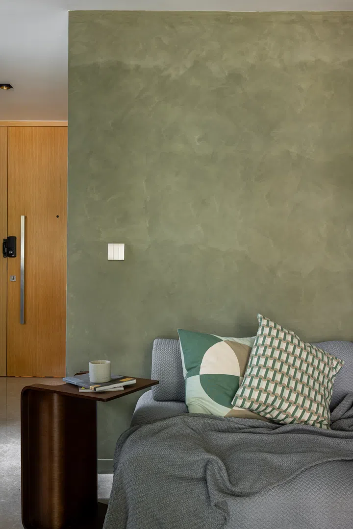 The living room back wall facing the balcony patio. 