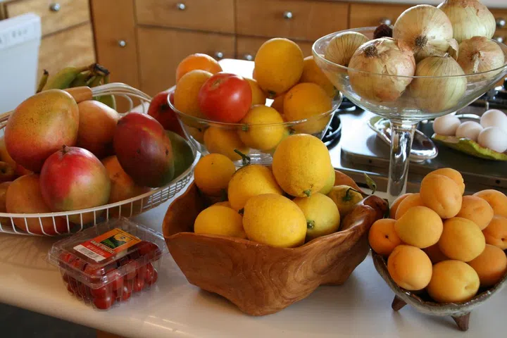 fruits, counter, lemons, mangoes, apples, orange,