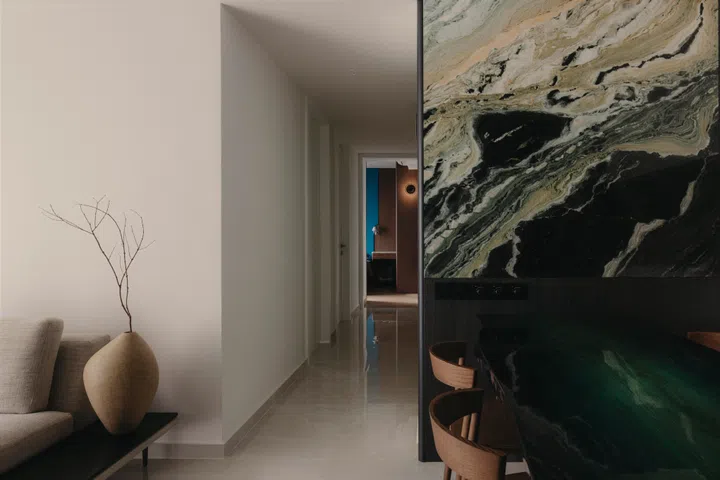 The dining area sits between the living space and kitchen, conceived as a calm, open, shared zone for everyday meals.