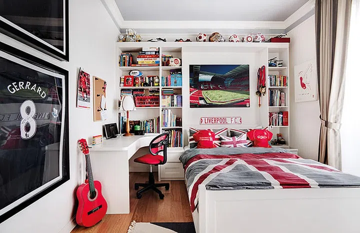 The bedroom of 10-year-old Alexander, a Liverpool fan, was designed to complement the poster of the team’s stadium. The lavender-grey ceiling creates a calming ambience for sleep. Interior design by Aiden T