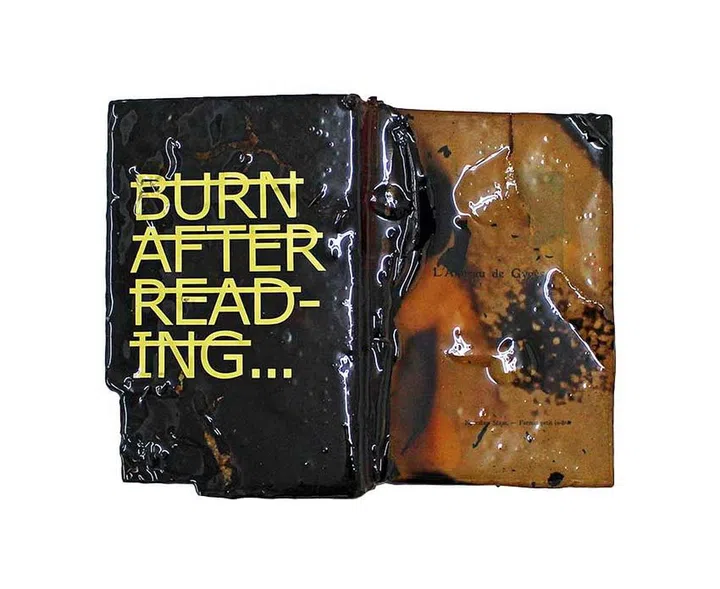 Untitled (Burn
After Reading...),
a 2016 artwork
made of a resincoated
book and
vinyl letters.