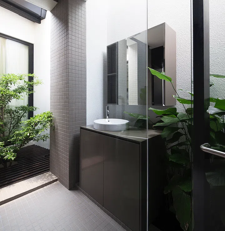 Lots of greenery fill the master bathroom, creating a relaxing ambience in this 2-storey corner terrace house in Telok Kurau.