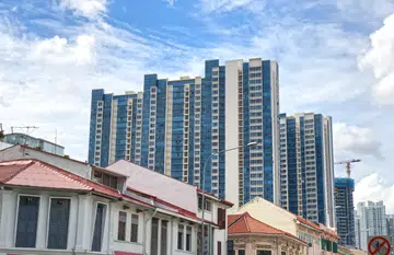 Singapore modern housing residential blocks behind row of old shop house - fusion/ contrast concept.