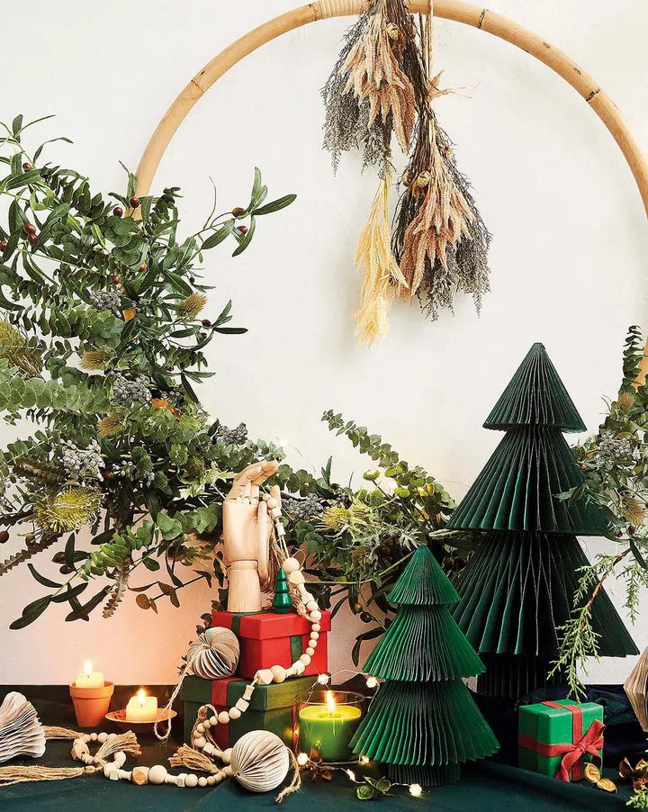 Rattan Christmas wreath decoration from Chun Mee Lee rattan furniture ($38) decorated with artificial flowers and forage, dried pampas grass, wheat, and dred Phalaris
