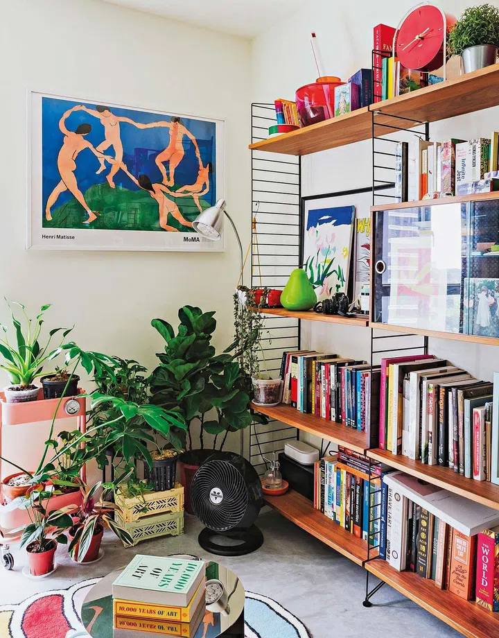 The couple’s growing collection of memorabilia, books, vinyl, art and décor pieces, and plants give the home a vibrant and dynamic feel.