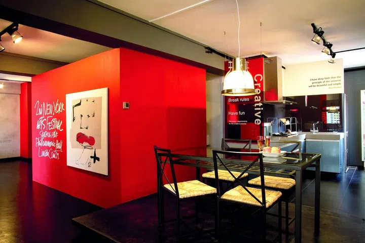 The quotes on the walls will inspire everyone who steps into this home. The Acrylic panel exhorting creativity is from the homeowner's office, while the quote on the wall by Albert Einstein is laser-cut from sticker paper.