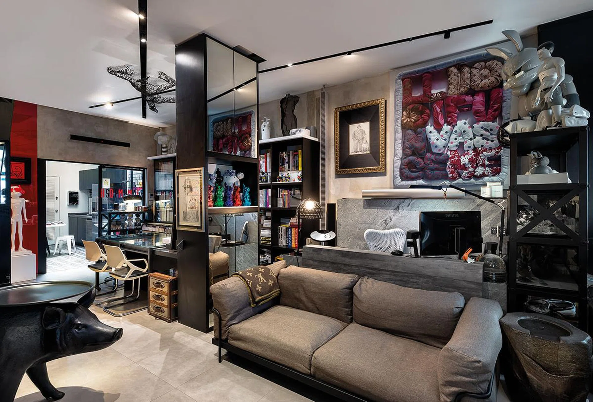 The ground floor, which serves as an entertainment and working space, is filled with the homeowner's treasured buys.