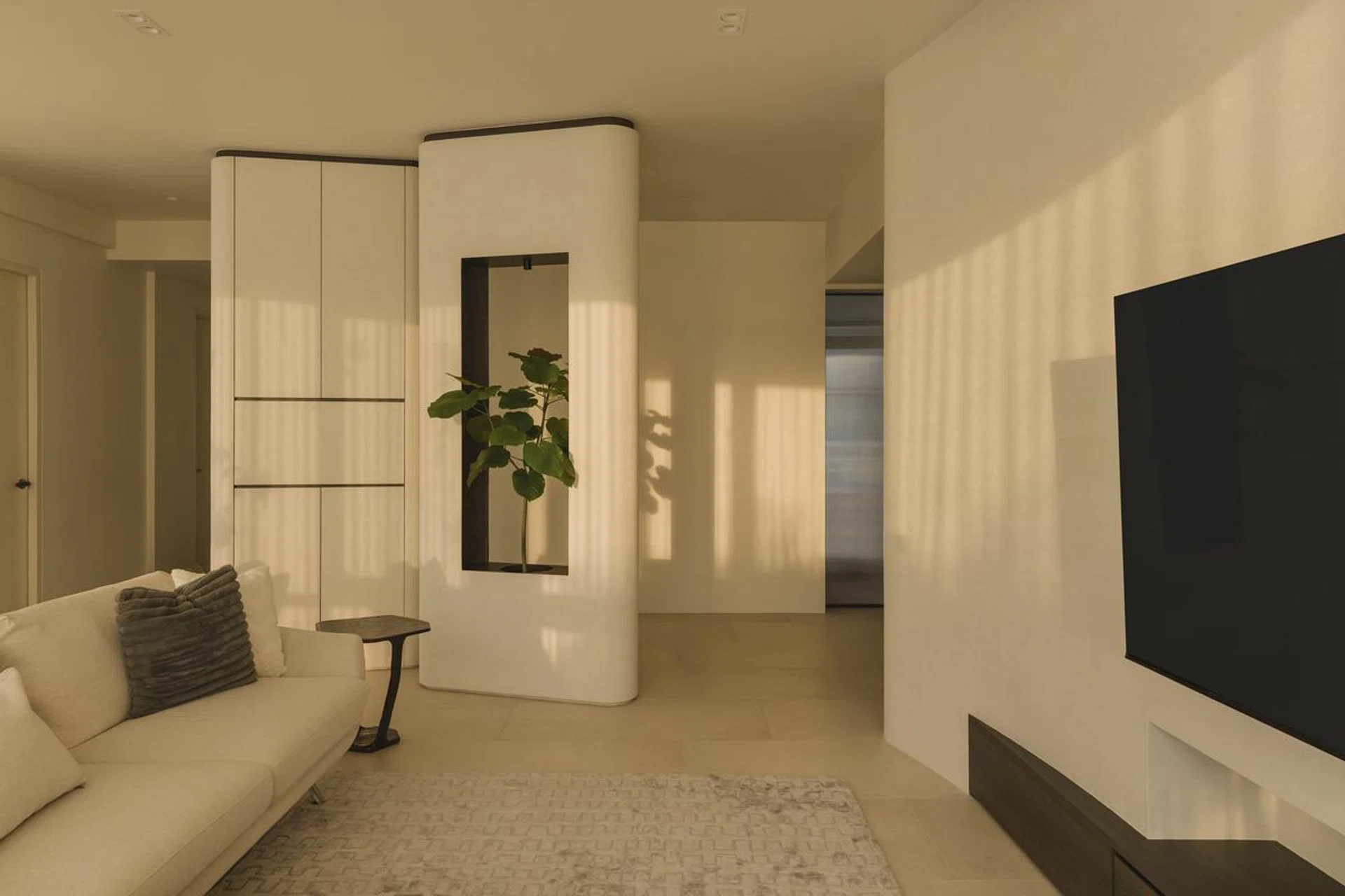 Sunset bathes the living room of a mother-daughter duo's private condominium in Serangoon Gardens.
