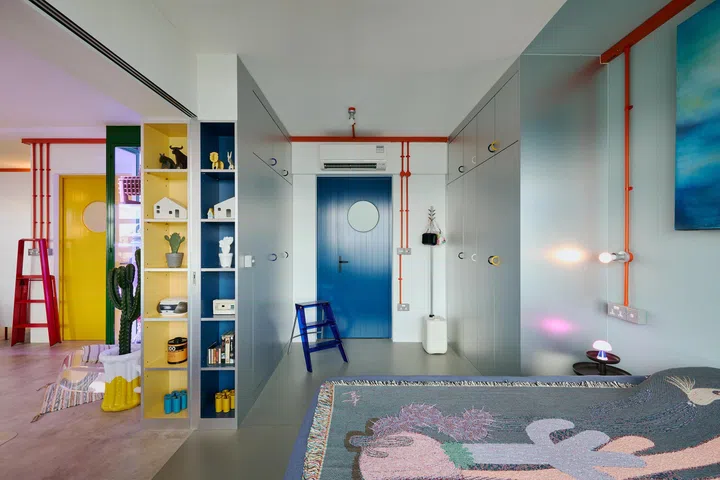 This quirky door with a porthole was custom designed to match the rest of the home.