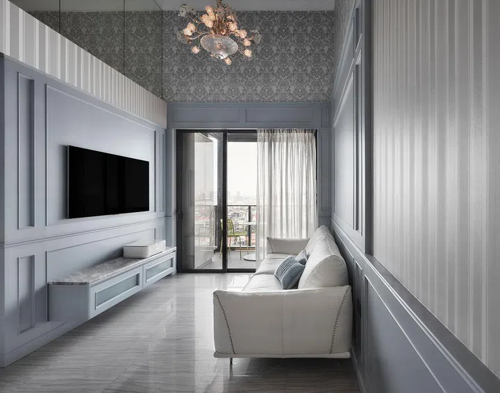 Living room in a flight steward's 2-bedroom with study condominium along Sims Drive designed by The Cottage Crafts.