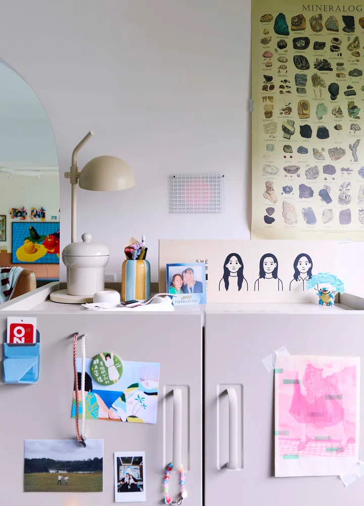 A glimpse of their mini art collection of quirky trinkets displayed on open shelves.