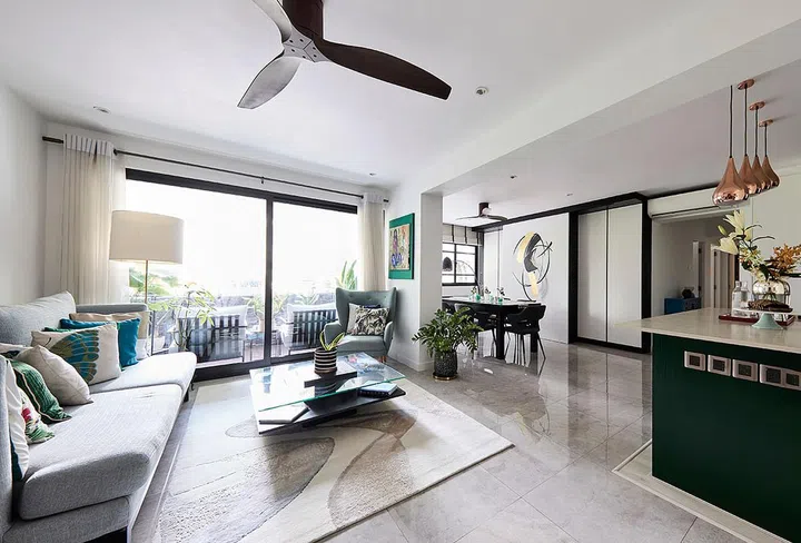 The pine green kitchen islands also boast marble countertops that match the kitchen backsplash.