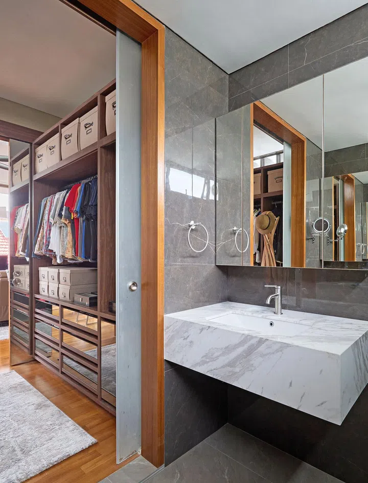 The walk-in wardrobe and attached bathroom in Sharne’s parents’ bedroom have a thoughtful and efficient His and Hers layout arranged on either side.