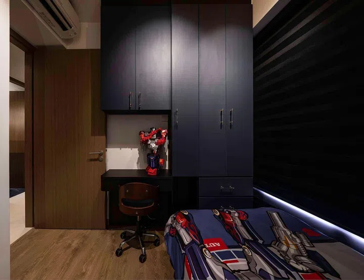 All black cabinets and study table in their son's bedroom in this banking couple's 3-bedroom condominium in West Coast.