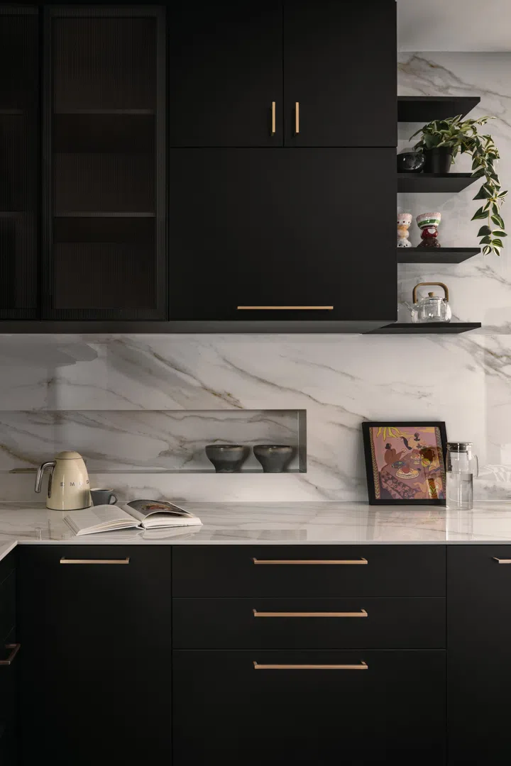 Wall niches and chamfered cabinetry in the kitchen.