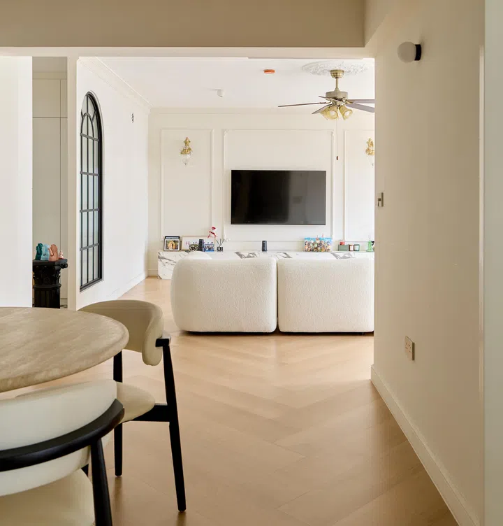 The living room is stylish, warm, and inviting.