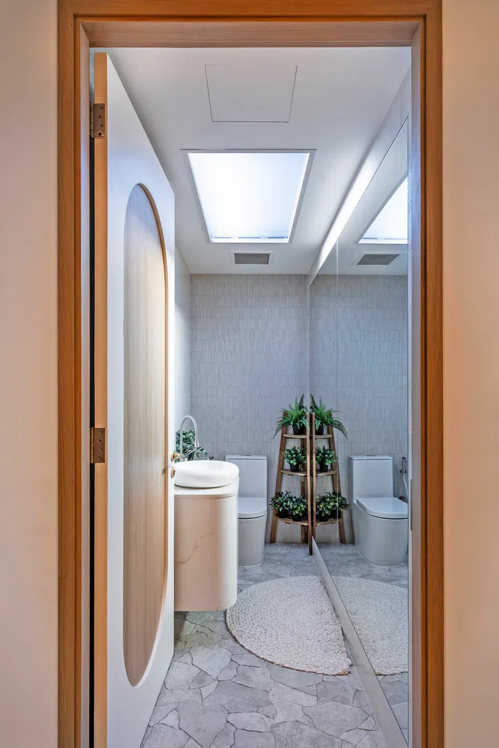 Spot the same floor and wall tiles as the primary en suite in the powder room.