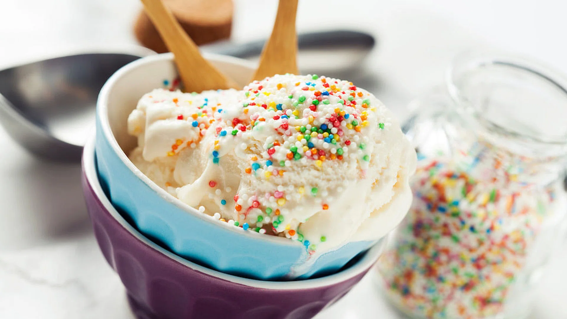 Vanilla ice cream in bowl with colorful sprinkles