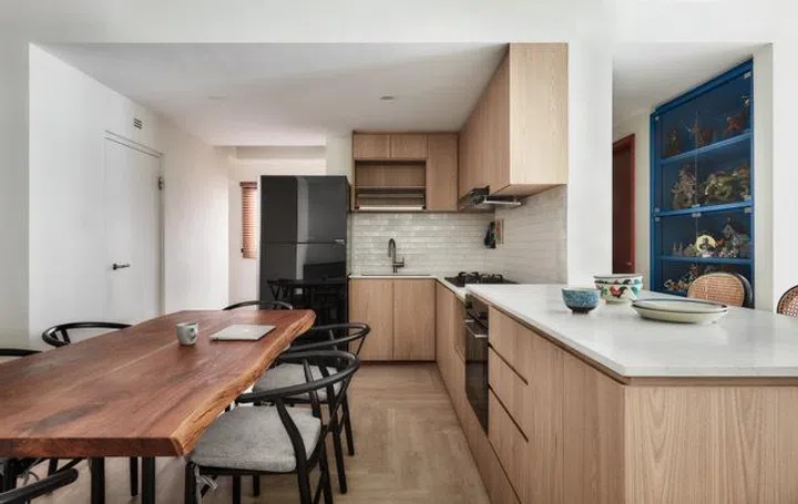 Open-plan layouts can make hosting feel more inclusive by allowing conversation and movement to flow more naturally between kitchen, dining, and living spaces.