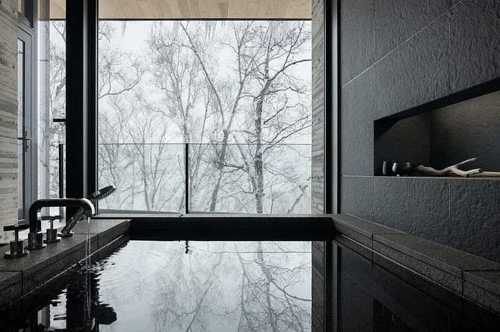 The guest room bathroom has a tranquil view in the OOAK Niseko holiday home. PHOTO: SOHEI OYA & IKUYA SASAKI