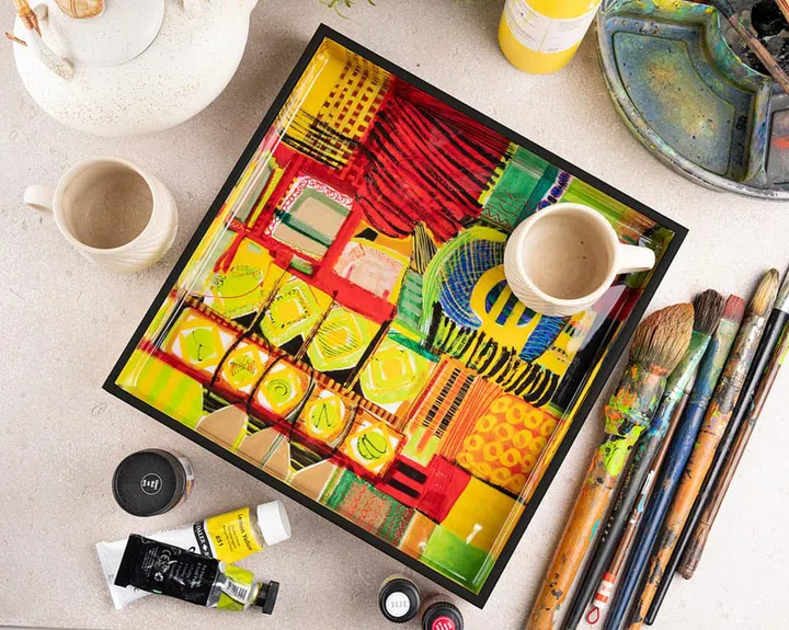 A tray with his artwork, Urban Renewal: Sun and Moon.