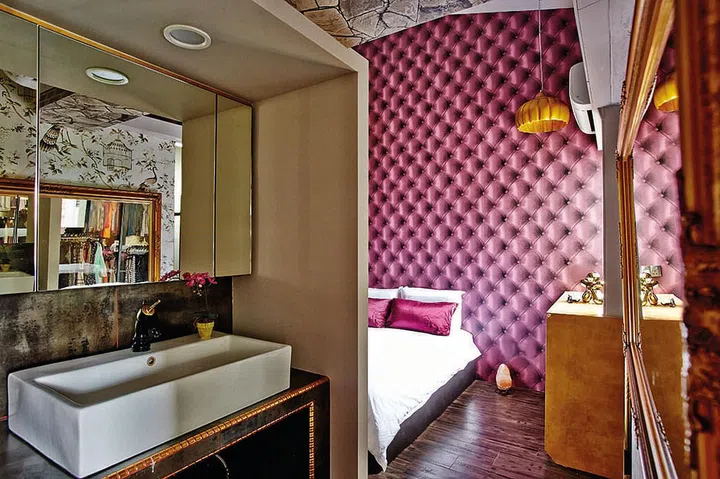 As the master bathroom is quite small, the homeowners moved the vanity area out to the entrance of the bedroom, but screened it off to provide privacy.