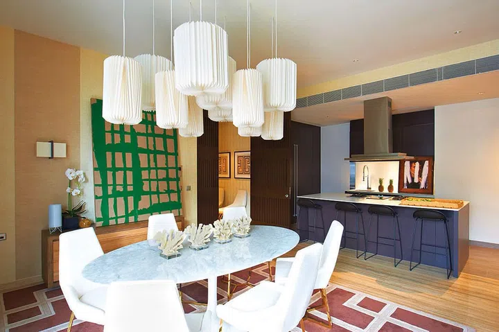 The cluster delicate Japanese folded rice-paper pendant lamps in the dining area is a favourite of the homeowners.