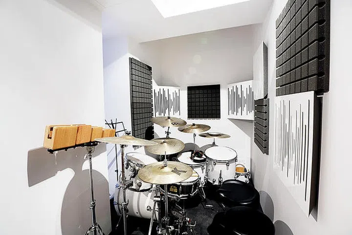Music room with sound panels for a drummer in a New York loft-style 5-room HDB flat.