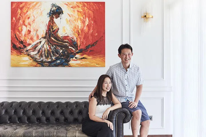Sheryl Kang and Seann Chua. The couple loves
art and their
apartment is
filled with art
pieces, some
of which are
self-drawn.
This piece in
the living room
behind them
portrays a
ballerina waiting
to dance and
it is by a street
artist in Munich.
