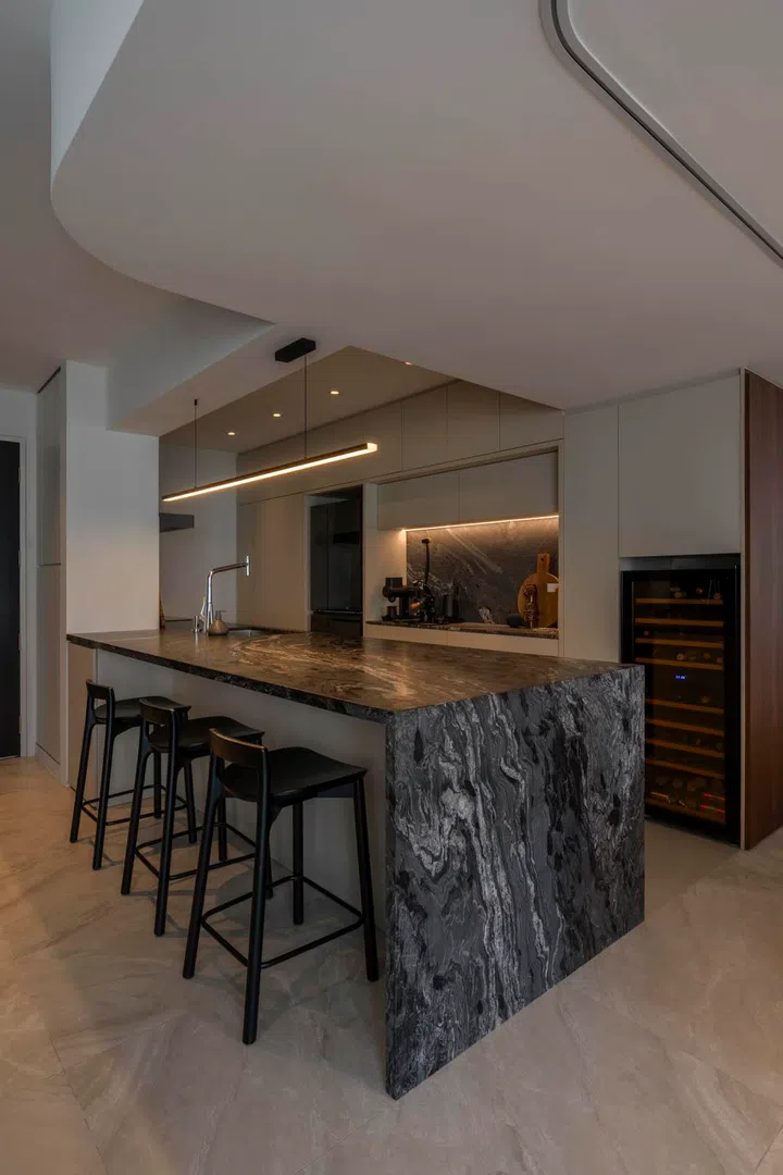 The dramatic granite island is the centrepiece of the home, built for cooking and entertaining.