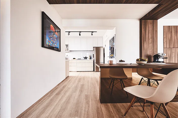 This fixed, L-shaped dining table plays many roles – it’s a kitchen worktop, as well as a desk.