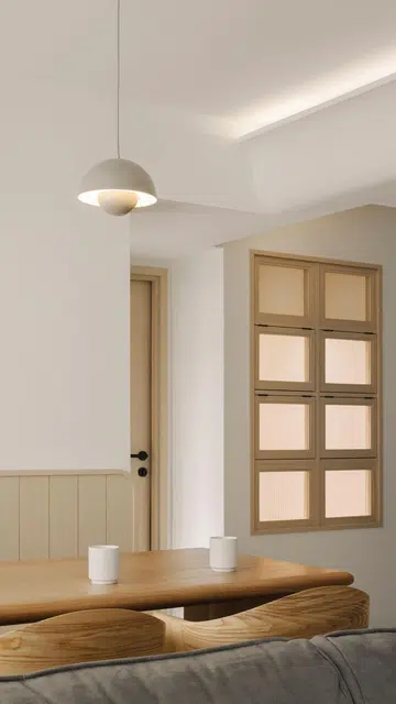 The toddler's bedroom has windows that inwardly face the dining and living areas of this 4-room HDB in Punggol.