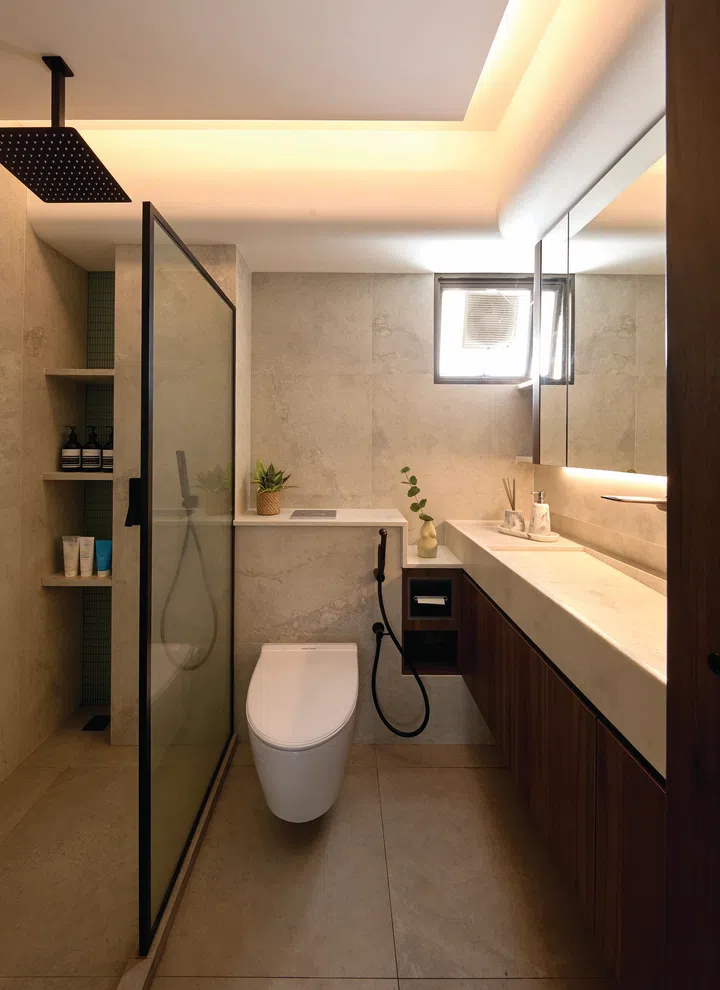 The master bathroom balances form and function with elegant finishes and clever storage solutions.
