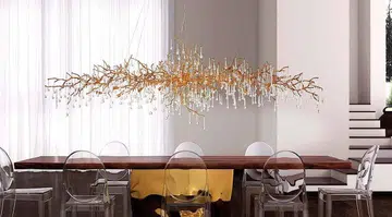 A Bijout chandelier hanging above a dining table.