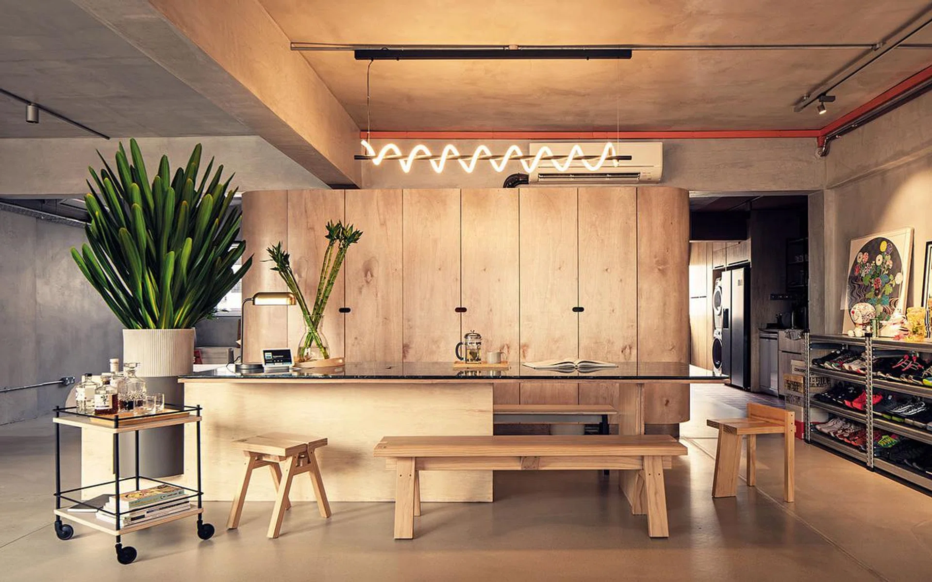 Melvin incorporated micro- cement in this kitchen space as a means of demarcating between activity and circulation, resulting in this sleek and linear design.
