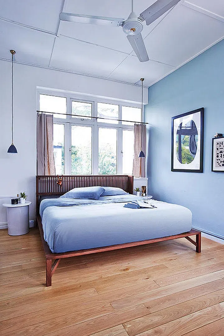 blue walls, blue themed, calming bedroom, wooden bedframe