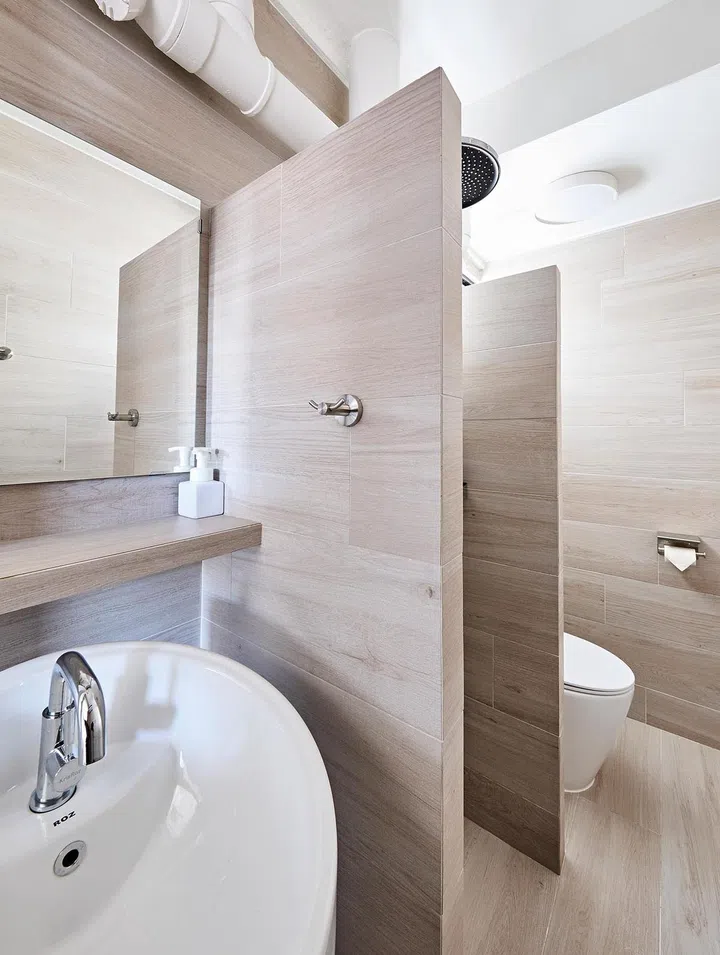 A restrained colour palette throughout the apartment, including the bathrooms, creates a cohesive scheme.