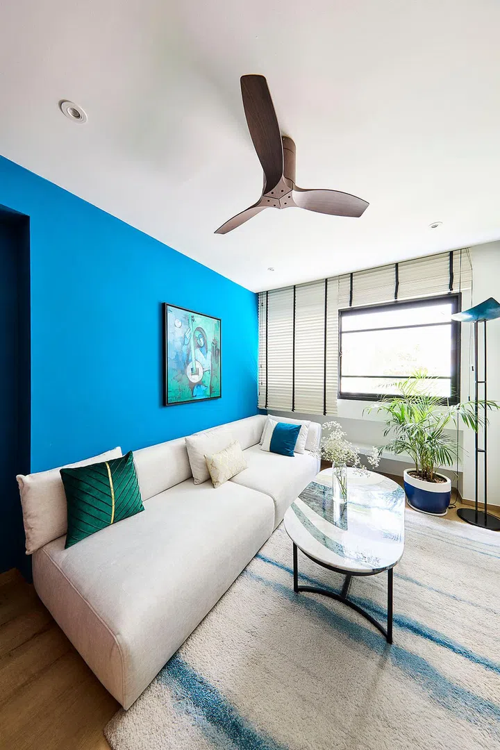 A pre-loved sofa from Gayatri’s parents finds new life in the entertainment room.