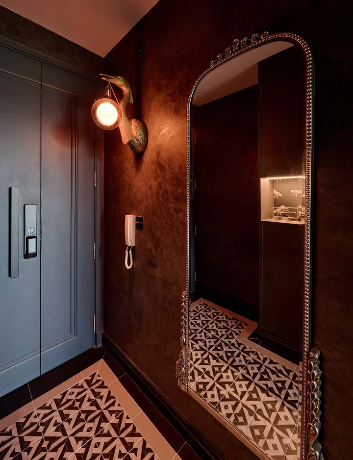 The landing foyer features a geometric tile pattern, marking the entrance with style and function.