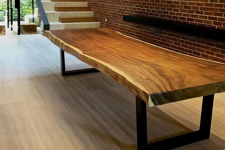 Customers can choose their desired piece of timber, as the shapes, grains and colour vary. Photo: Herman Furniture