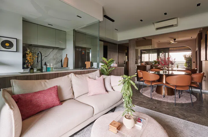 Another angle of the open-plan living space, showcasing seamless transitions between lounging, dining, and kitchen zones in a cohesive palette.
