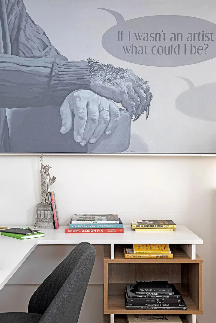 A huge artwork in the study sets the scene for work area.